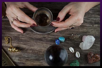 Witch casting magic ritual with gemstones Witch casting magic ritual with gemstones